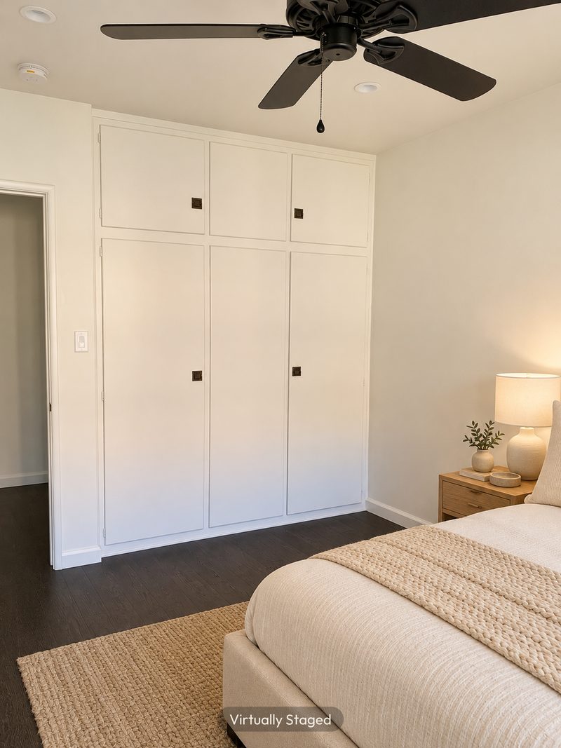 Bedroom with built in closets, virtually staged