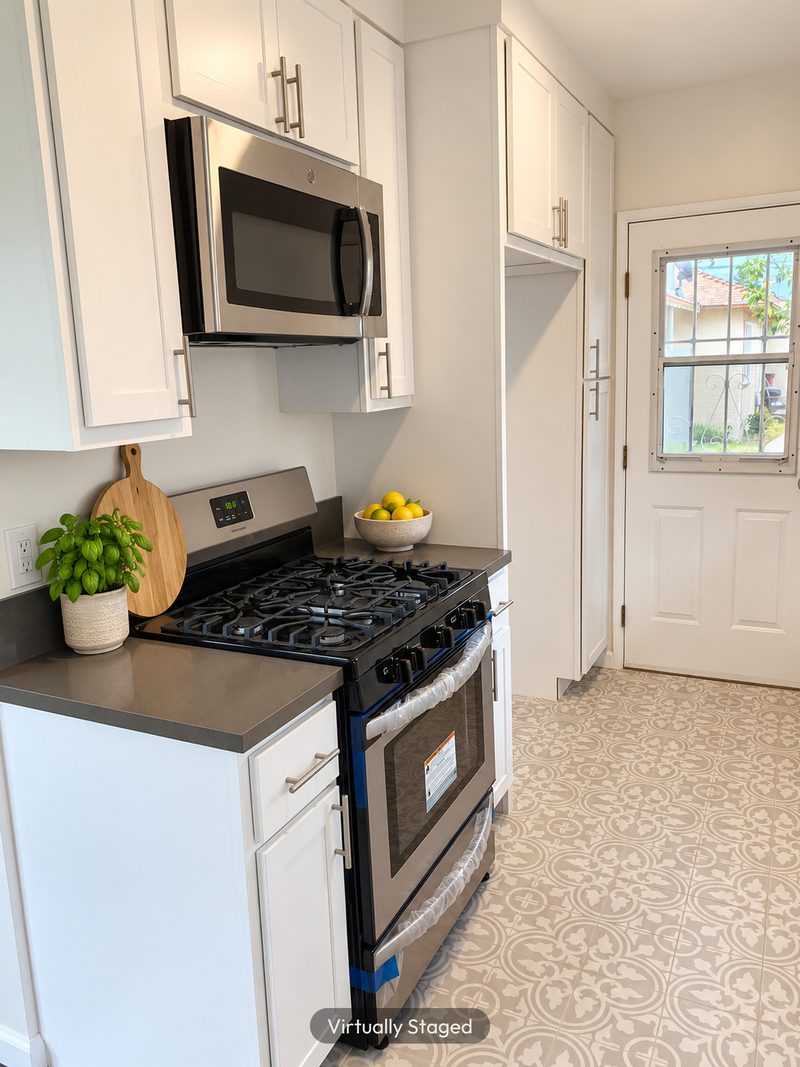Kitchen with a patterned tile floor, virtually staged