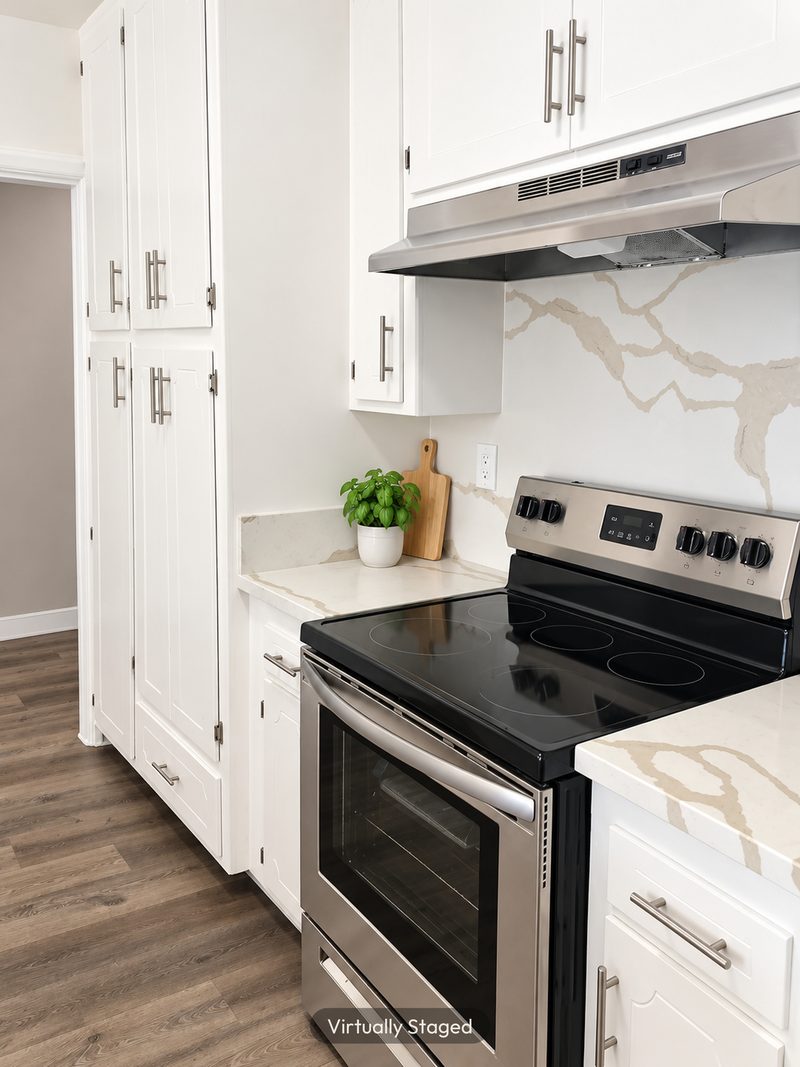 Kitchen with a stainless range, virtually staged