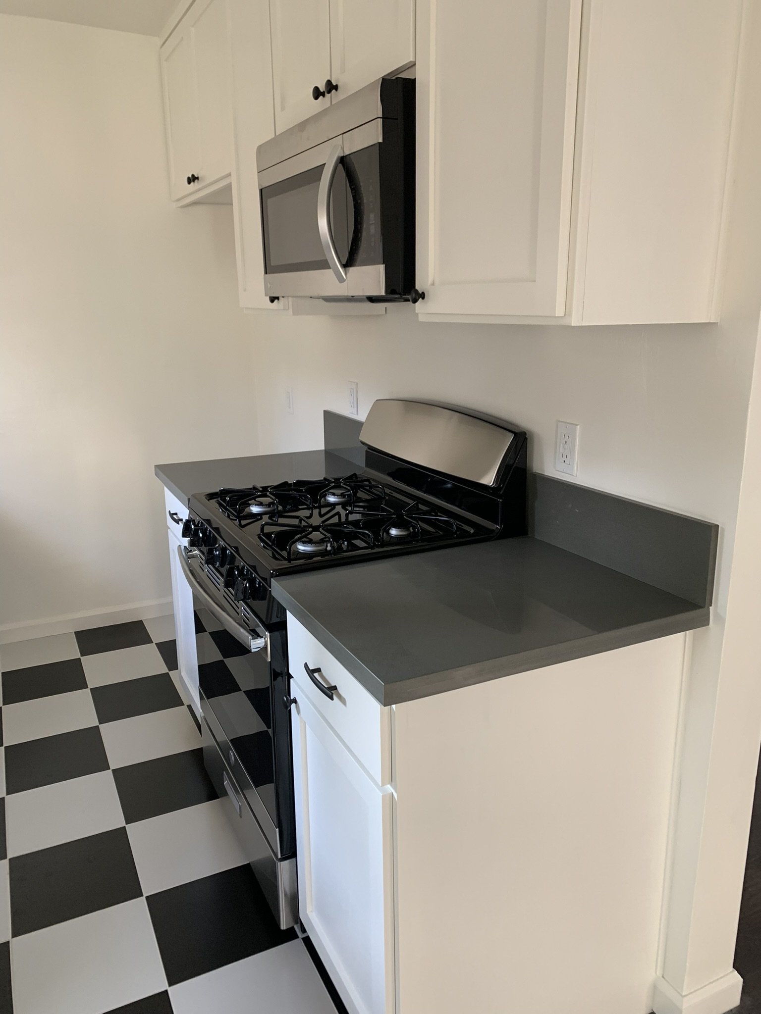 Kitchen with a checkerboard floor, original unaltered photo